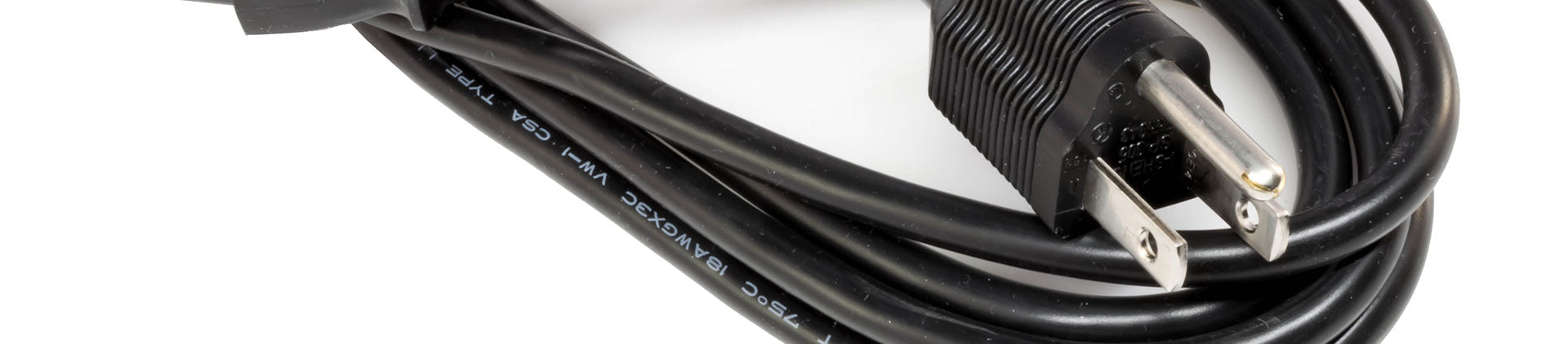 Close-up image of a black computer power cable with a three-prong plug and visible labeling on the cable, coiled neatly on a white background.
