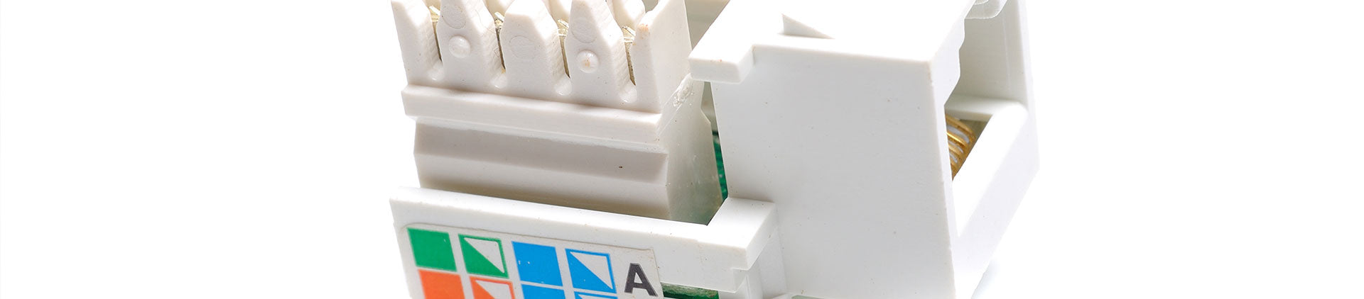 Close-up image of a white keystone jack with clearly visible punch-down terminals and color-coded wiring guides, designed for Ethernet cable termination, shown on a white background.