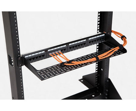 Cable organizing shelf mounted on a rack with cables