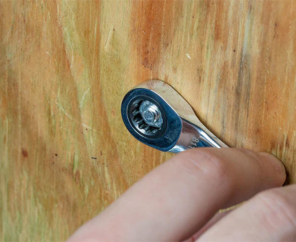 Close-up of a 7/16" Ratcheting Stubby Speed Wrench in a person's hand