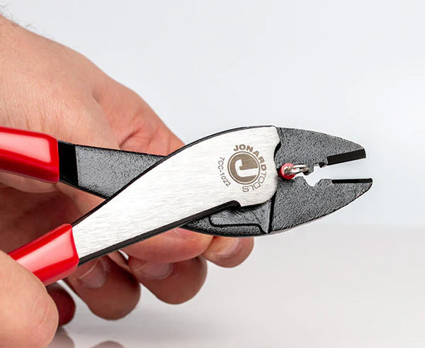A user operating the 9-inch Terminal Crimper & Cutter with red and black handles
