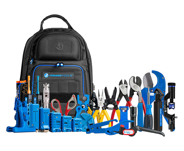 Opened tool bag displaying the Ultimate Backpack Fiber Prep Kit's assortment of tools