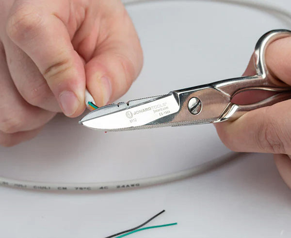 Wire cutting in action with scissors from the Splicer's Kit