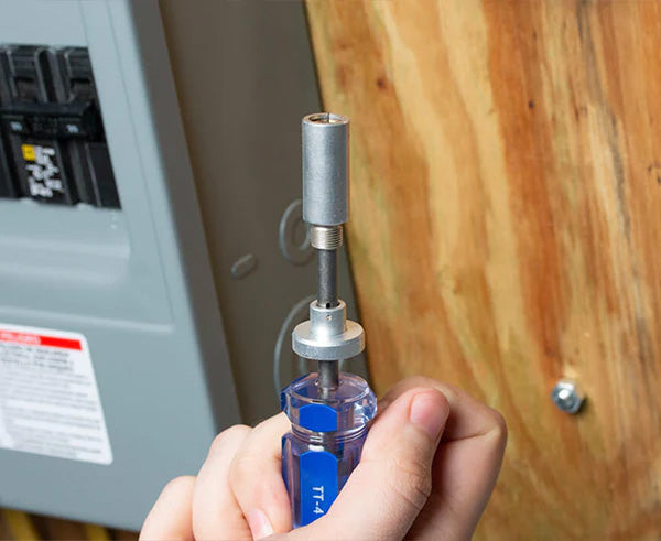 A person using the 4 1/2" Terminator Tool near an electrical outlet