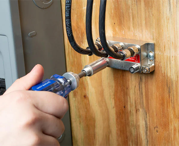 The 4 1/2" Terminator Tool being used to secure a wire into an outlet