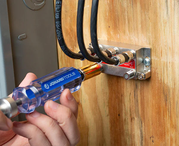 The 7 1/2" Terminator Tool being used to fasten a wire to a wooden structure