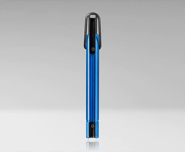The Trap and Security Combo Tool with a blue body and black handle resting on a white surface