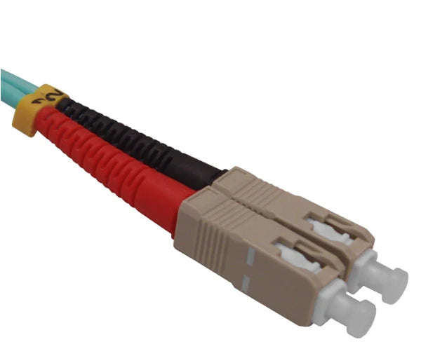 Two SC OM3 connectors on aqua fiber.