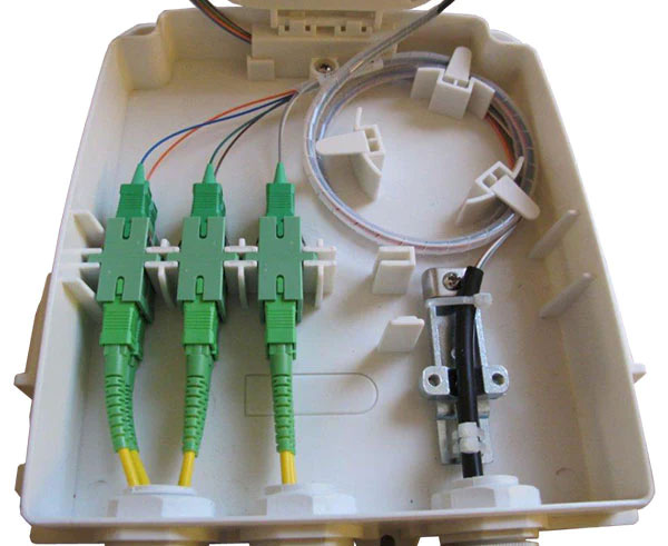 8 Port FTTH wall mount plastic fiber distribution unit with lid and splice tray removed.