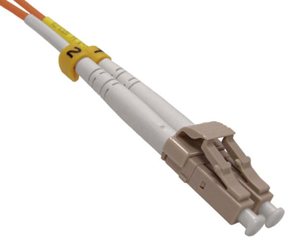 A single LC UPC connector with beige body, dust caps and locking tab.