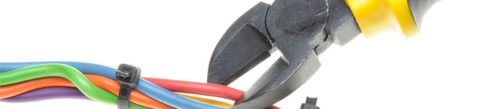 A cable cutter about to cut a network cable. 