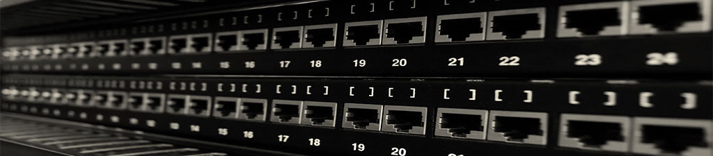 Blank RJ45 patch panels in a data center.