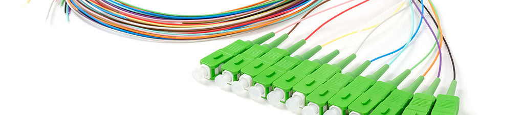 A fiber optic pigtail with SC APC connectors.