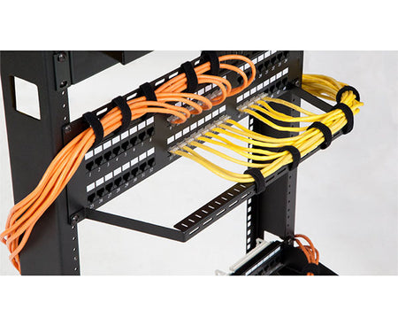 The 5-inch D-flanged lacing bar in use, supporting cables in a rack setup
