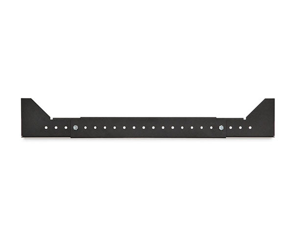 Close-up of a black metal network rack shelf with screw holes