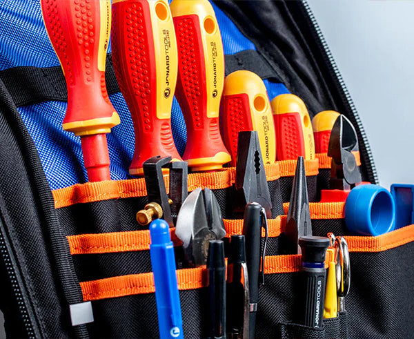 A well-organized tool bag backpack with equipment for professional use
