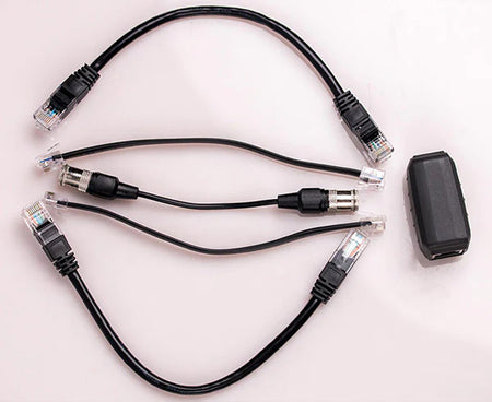 Cable Mapper Pro accessories including a trio of ethernet cables and a control unit