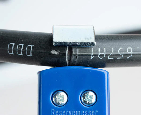 Detailed view of a Round Cable Strip & Ring Tool with blue and black handles for cables 8 to 28 mm OD