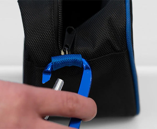 A rugged tool carry case with a sturdy handle being held by a person
