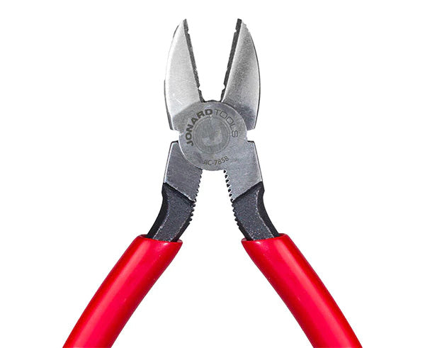 Diagonal cutting pliers with red grips isolated on a white surface