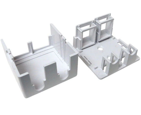 Pair of white blank surface mount boxes with pre-cut holes for cable entry