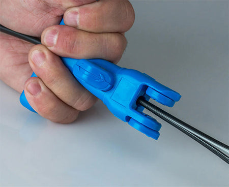 Precise cutting of a wire using the kit's ergonomic blue tool