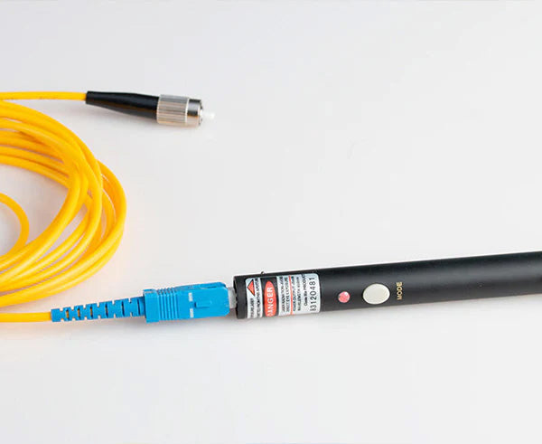 The components of the Visual Fault Locator Kit with a focus on the yellow optical cable