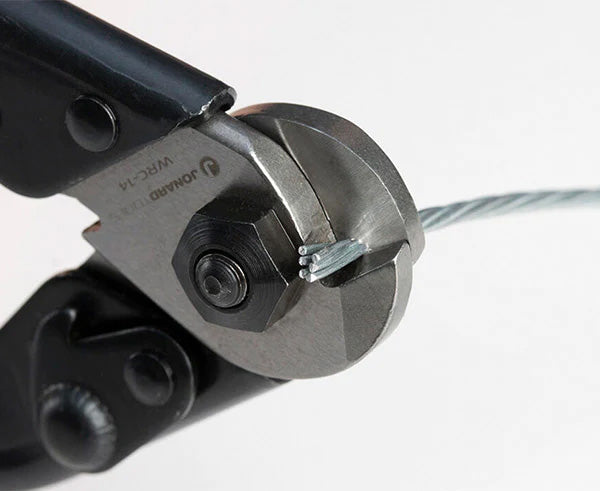Detailed view of the wire cutter's cutting mechanism with wire in place