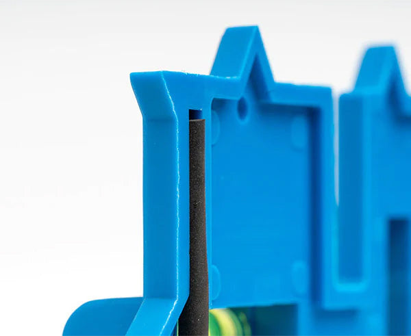 Detailed view of the Wall Box Template's blue leveling tool with ergonomic black grip