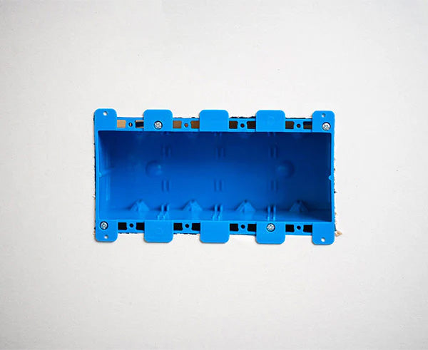 A blue non-metallic 4-gang box with pre-drilled mounting holes on its side