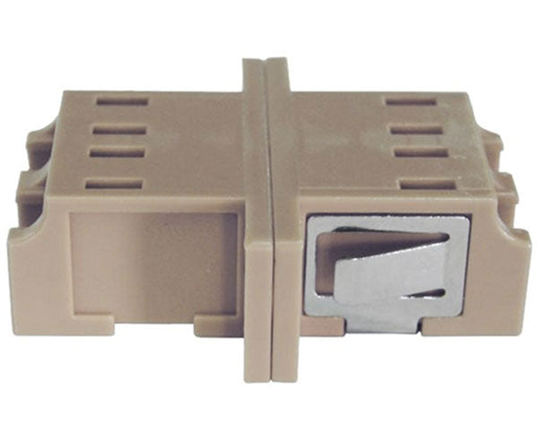 A beige duplex LC fiber optic adapter with metal clips.