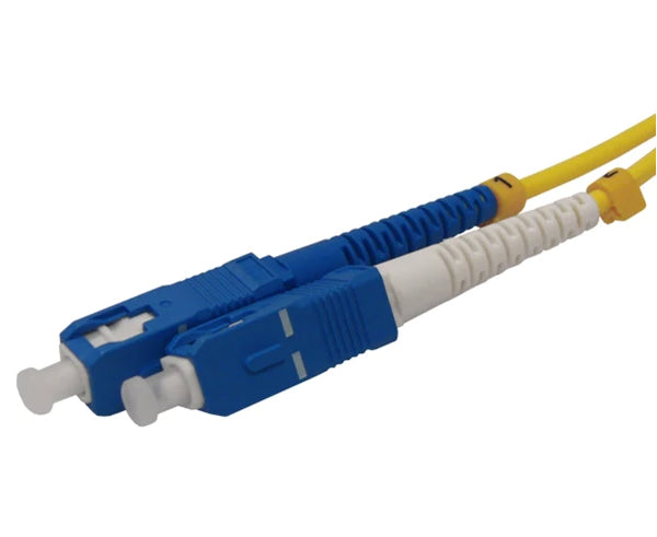 Two SC single-mode OS2 connectors on yellow fiber with dust caps.