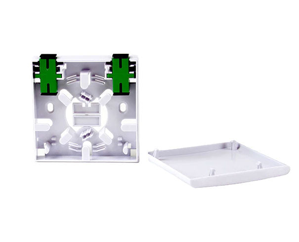 White plastic indoor wall mount fiber surface mount box with open lid and SC adapters.