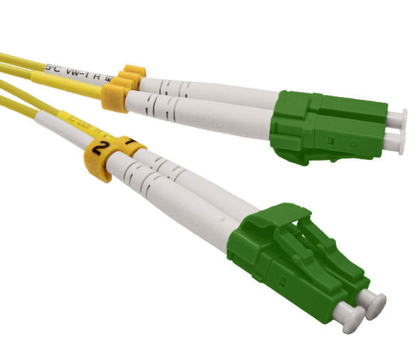 A pair of duplex LC APC connectors with green body.