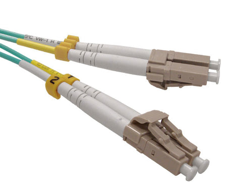 A pair of duplex LC OM3 connectors with beige body and aqua fiber.